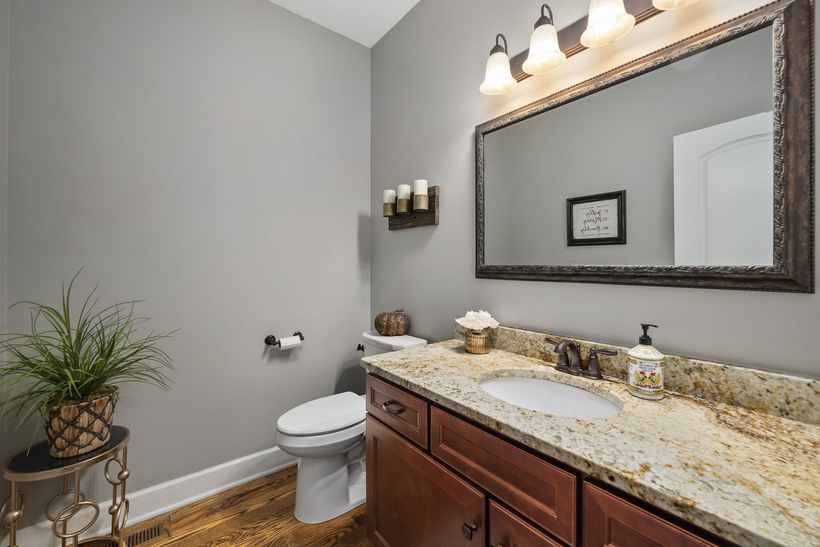 301 Arrowhead Drive Minooka, IL 60447 - Photo 18 of 43 a bathroom with a granite countertop sink a toilet and a mirror