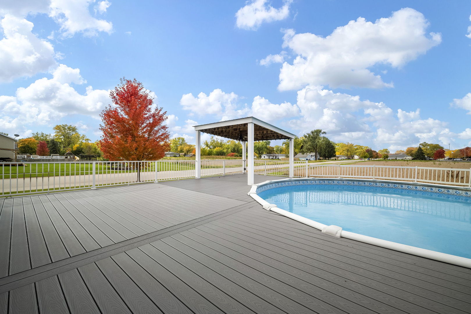 301 Arrowhead Drive Minooka, IL 60447 - Photo 32 of 43 a view of a swimming pool with an outdoor space and seating area