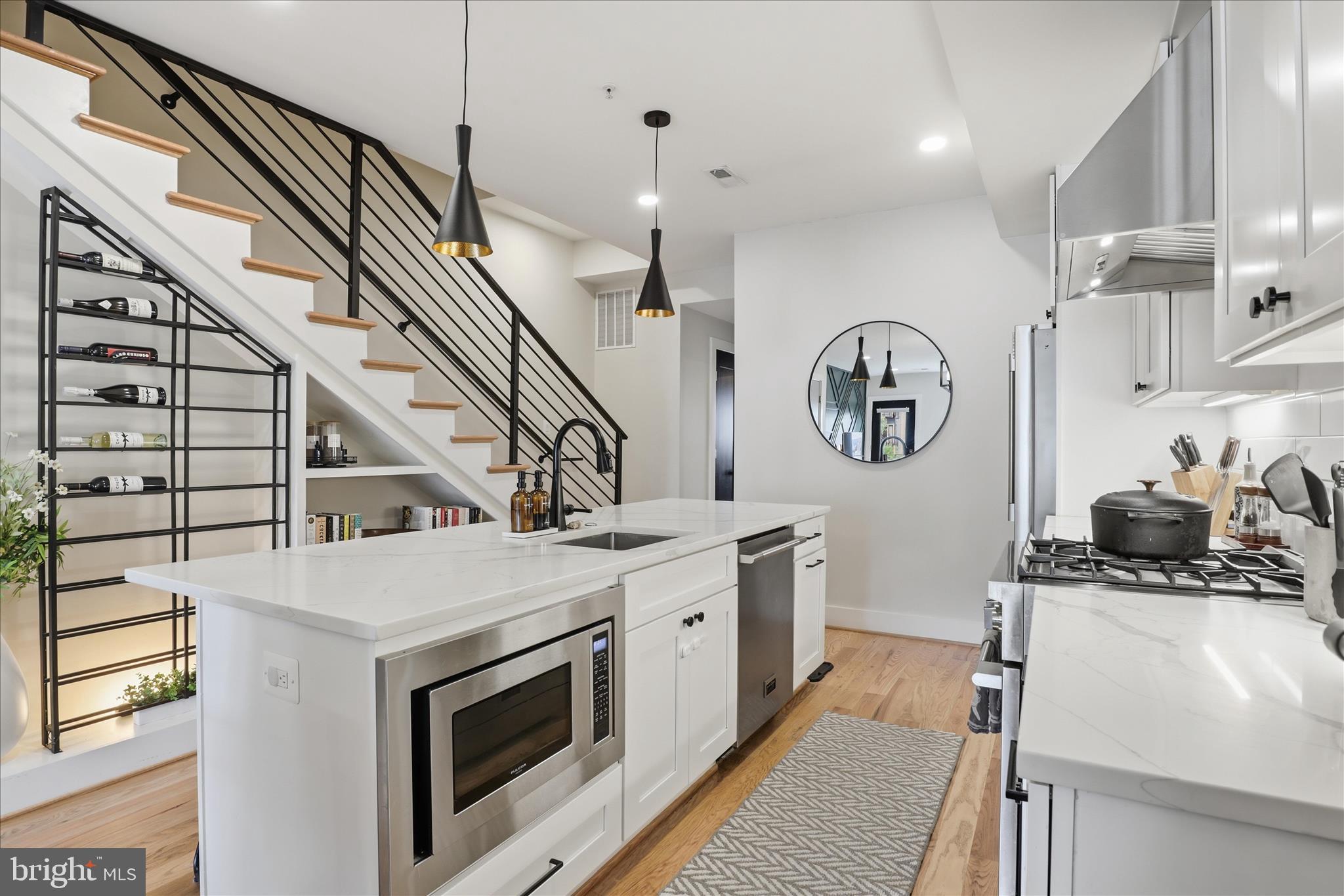 1222 Neal Street Northeast, Unit 3 Washington, DC 20002 - Photo 12 of 38 a view of a kitchen with cabinets and stainless steel appliances