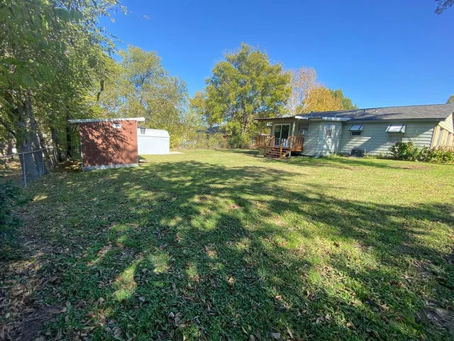 a view of a house with a big yard