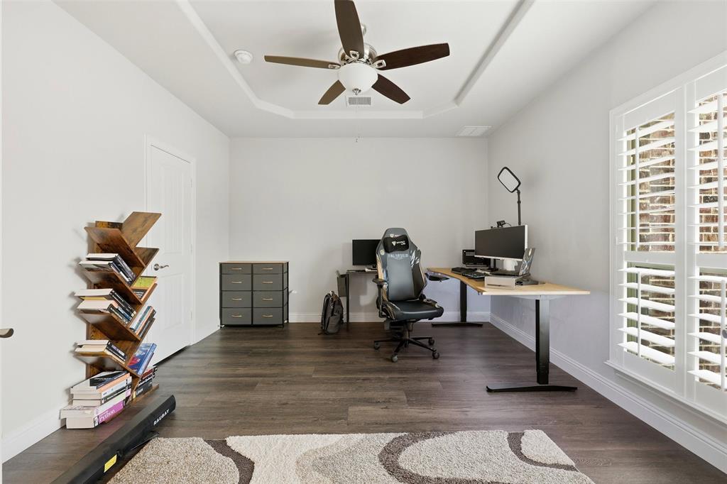 418 Crestview Drive Midlothian, TX 76065 - Photo 7 of 39 Office featuring dark wood-style floors, a ceiling fan, and a tray ceiling