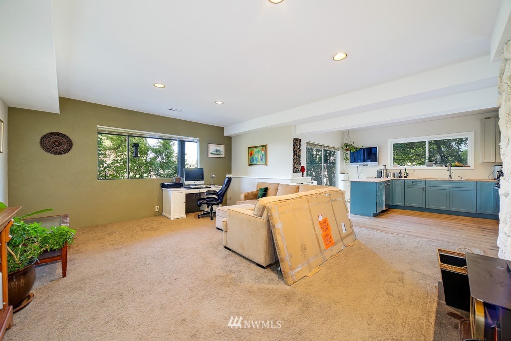 8438 Tillicum Road Southwest Seattle, WA 98136 - Photo 18 of 22 a living room with furniture and a large window
