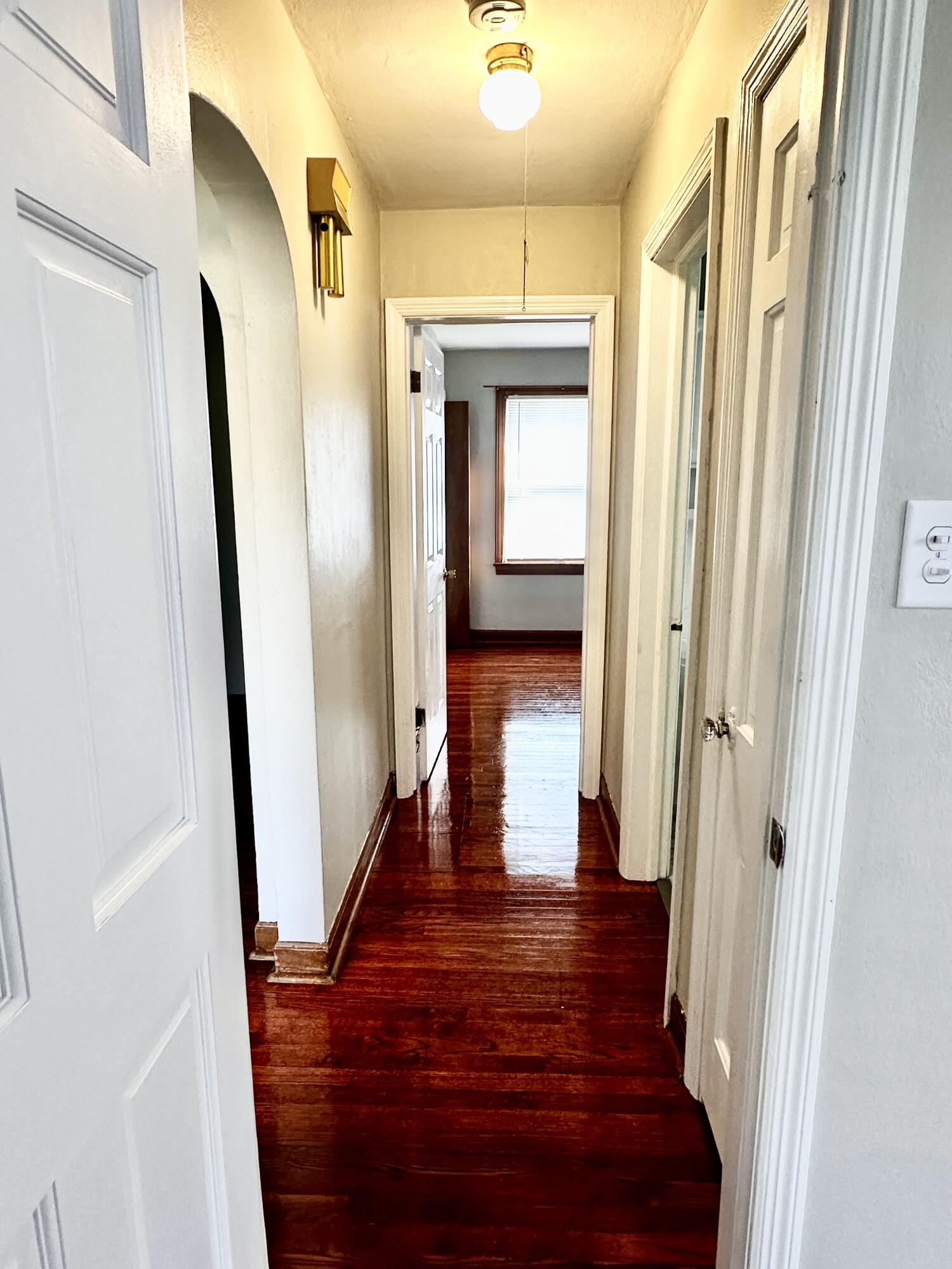 939 175th Place Hammond, IN 46324 - Photo 18 of 40 a view of a hallway with wooden floor and staircase