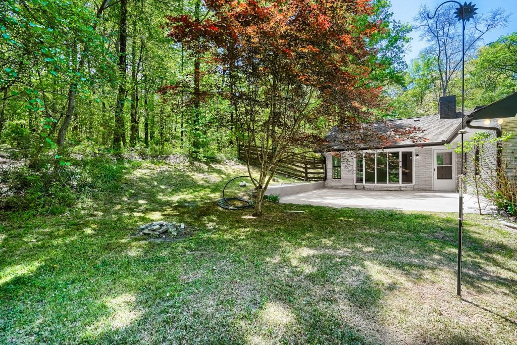 2021 Irwin Bridge Road Northwest Conyers, GA 30012 - Photo 41 of 43 a house view with a garden space
