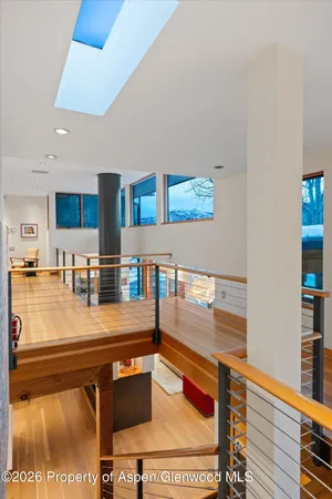 a view of a balcony with furniture and floor to ceiling window