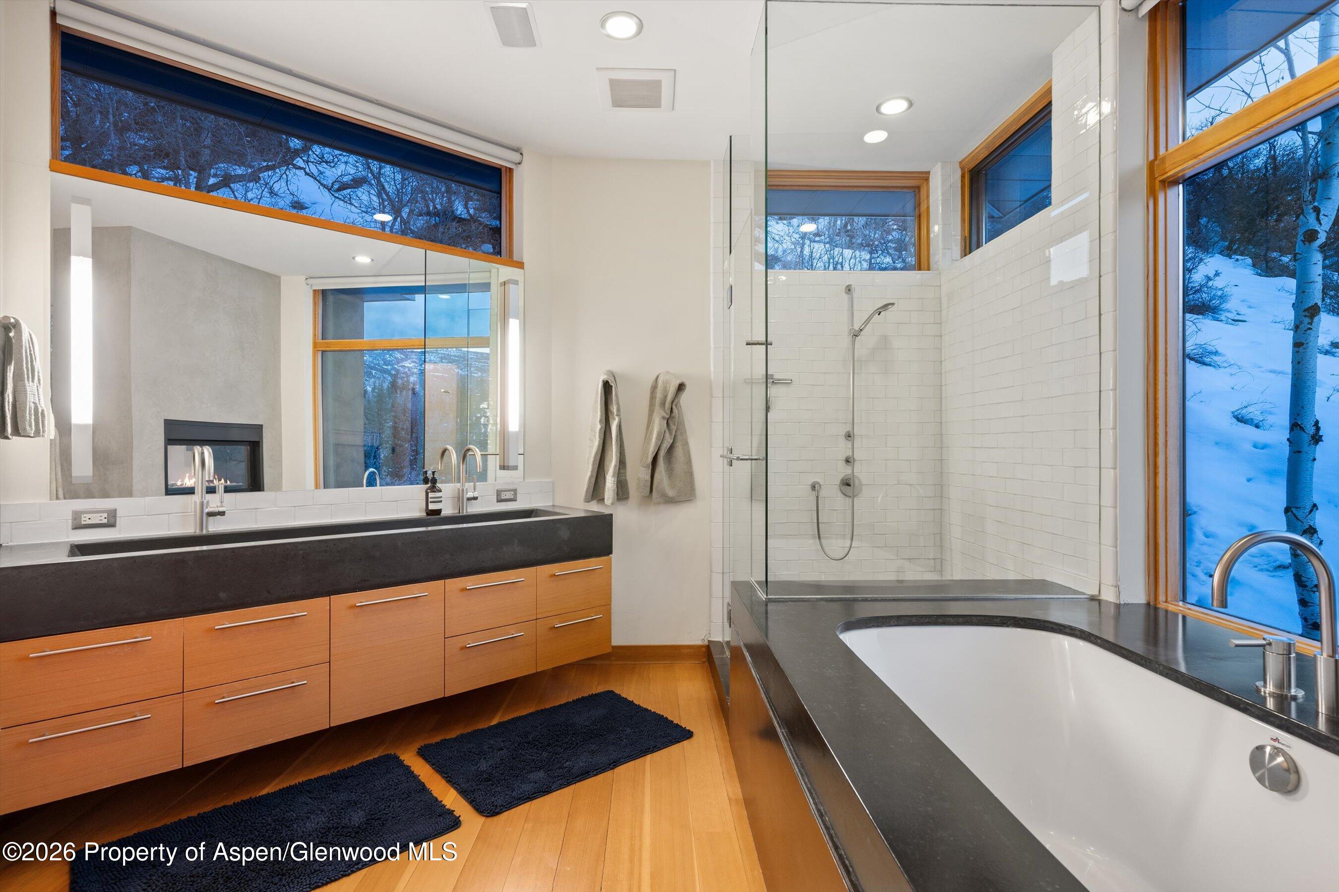 8389 Upper River Road Woody Creek, CO 81656 - Photo 18 of 27 a bathroom with a bathtub and a sink