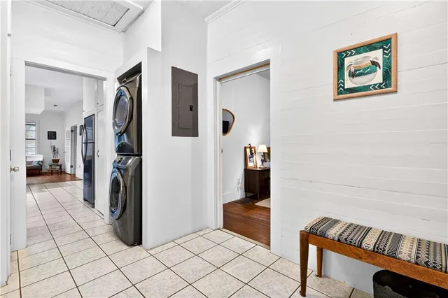 a view of a hallway with workspace and closet