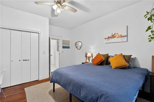 a bedroom with bed and window