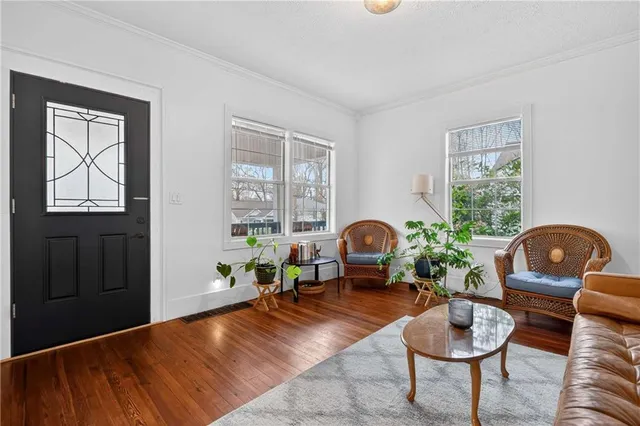 a living room with furniture and window