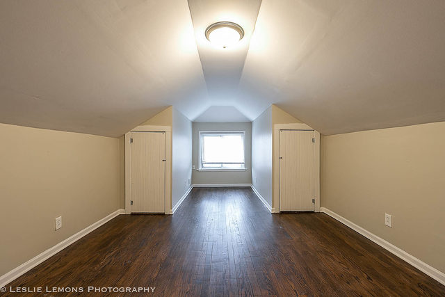 5331 West Addison Street Chicago, IL 60641 - Photo 18 of 32 wooden floor in an empty room with a window