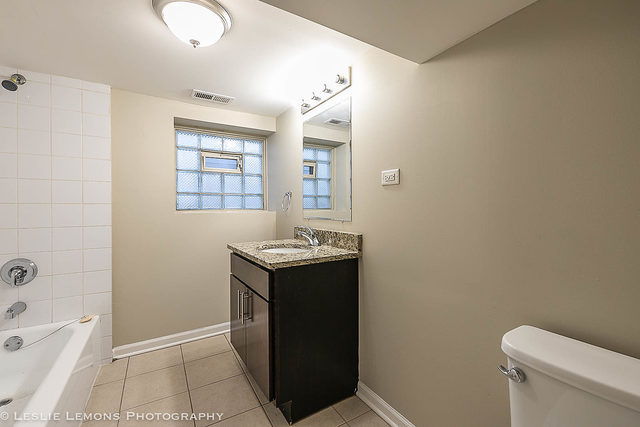 5331 West Addison Street Chicago, IL 60641 - Photo 20 of 32 a view of bathroom with a sink and mirror