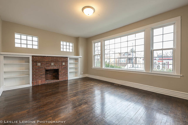 5331 West Addison Street Chicago, IL 60641 - Photo 3 of 32 a view of an empty room with wooden floor and a window