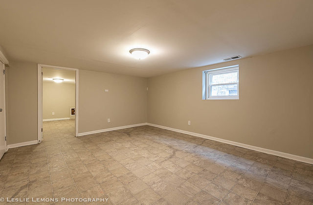 5331 West Addison Street Chicago, IL 60641 - Photo 25 of 32 an empty room with a empty space and windows