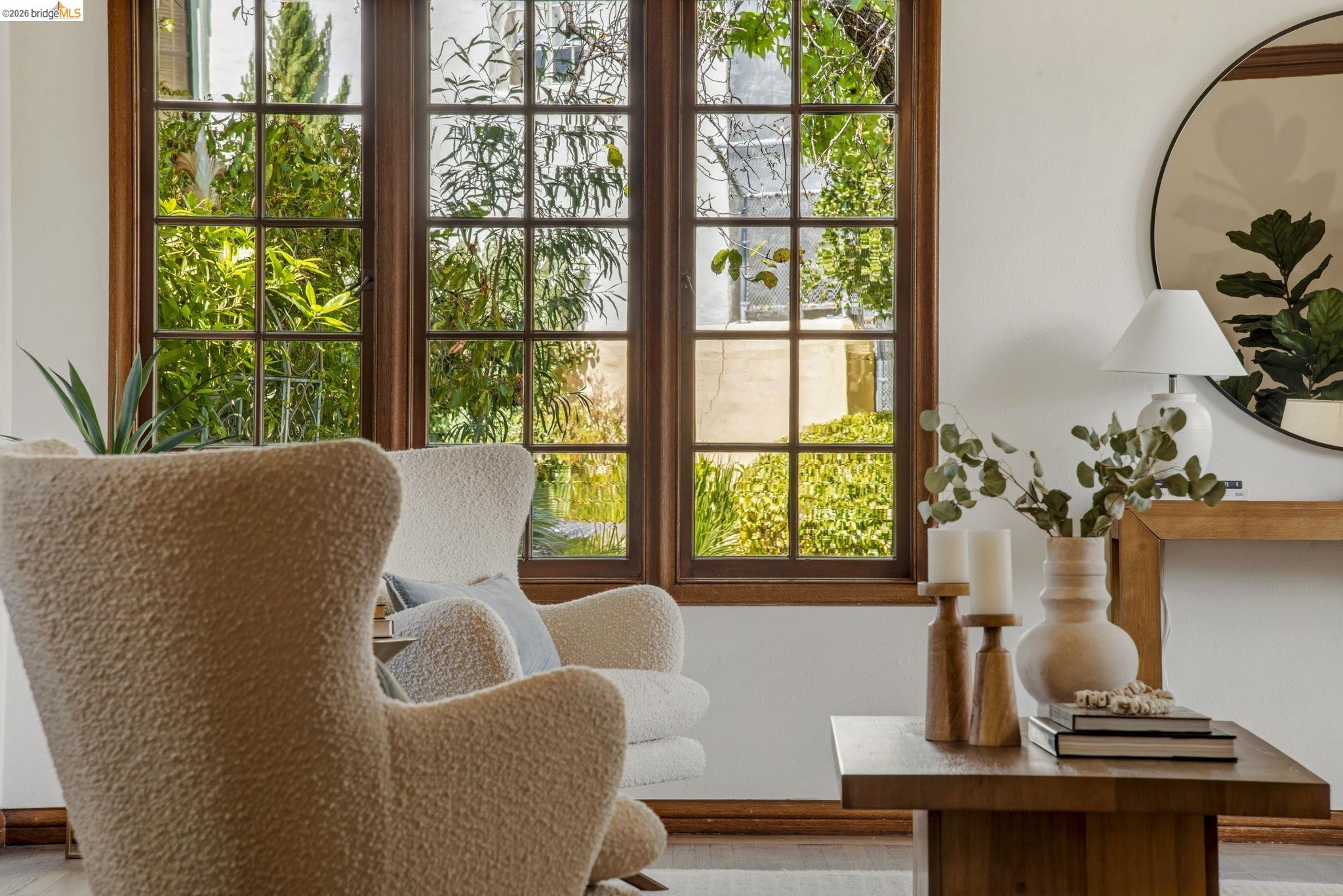 1087 Hubert Road Oakland, CA 94610 - Photo 45 of 67 White walls complement the dark wood trim and window frames of the grid-pane windows