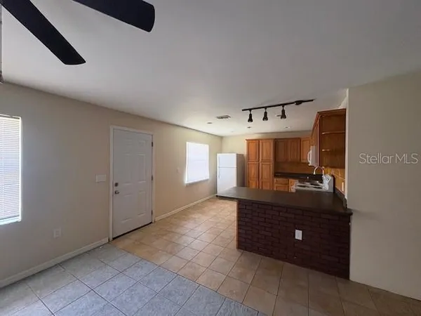 a view of room with a sink and a mirror