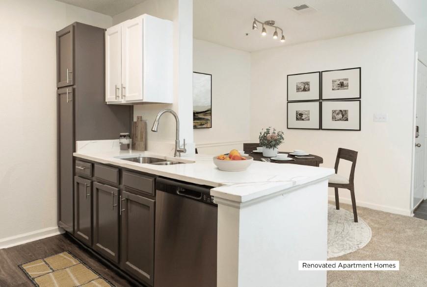 100 Akers Ridge Drive Southeast, Unit 1422 Atlanta, GA 30339 - Photo 2 of 15 a kitchen with a sink cabinets and a refrigerator