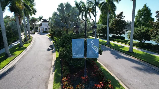 an aerial view of lake residential house with swimming pool and green space