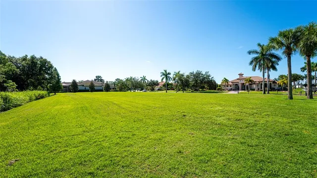 a view of a garden with a building in the background