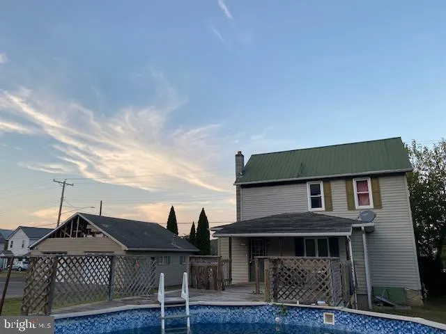 a view of house with outdoor space