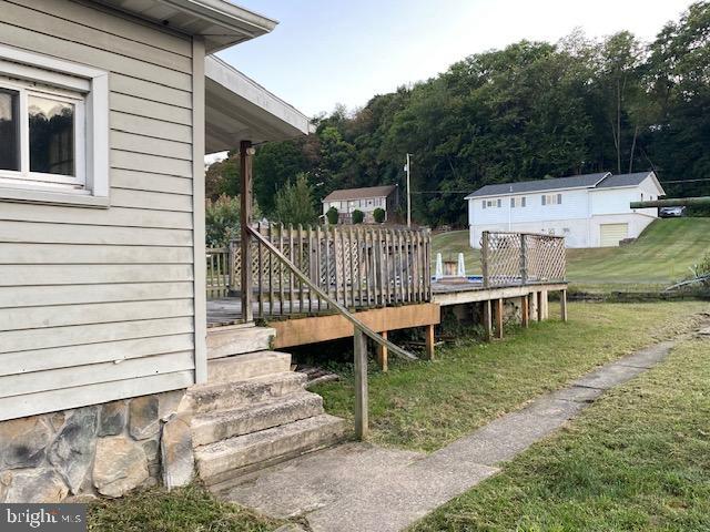 14074 2nd Street Mount Union, PA 17066 - Photo 6 of 31 a view of a deck with chairs and a yard with wooden fence