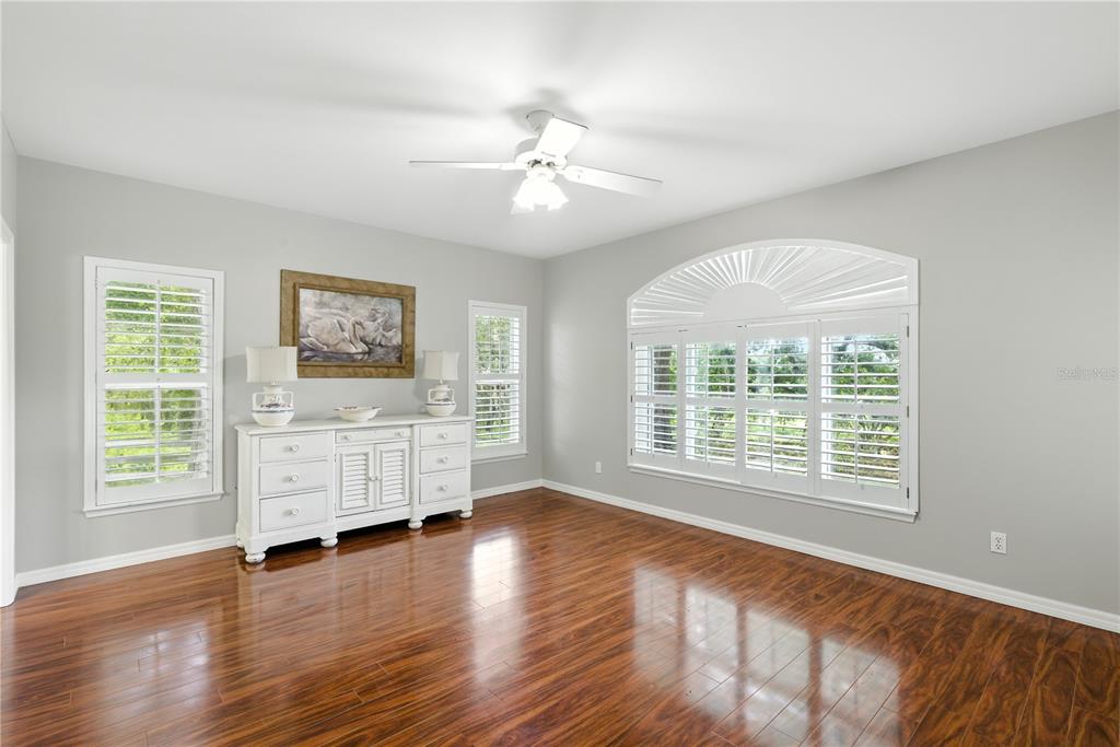 36641 Blanton Road Dade City, FL 33523 - Photo 14 of 76 a view of an empty room with a window and wooden floor