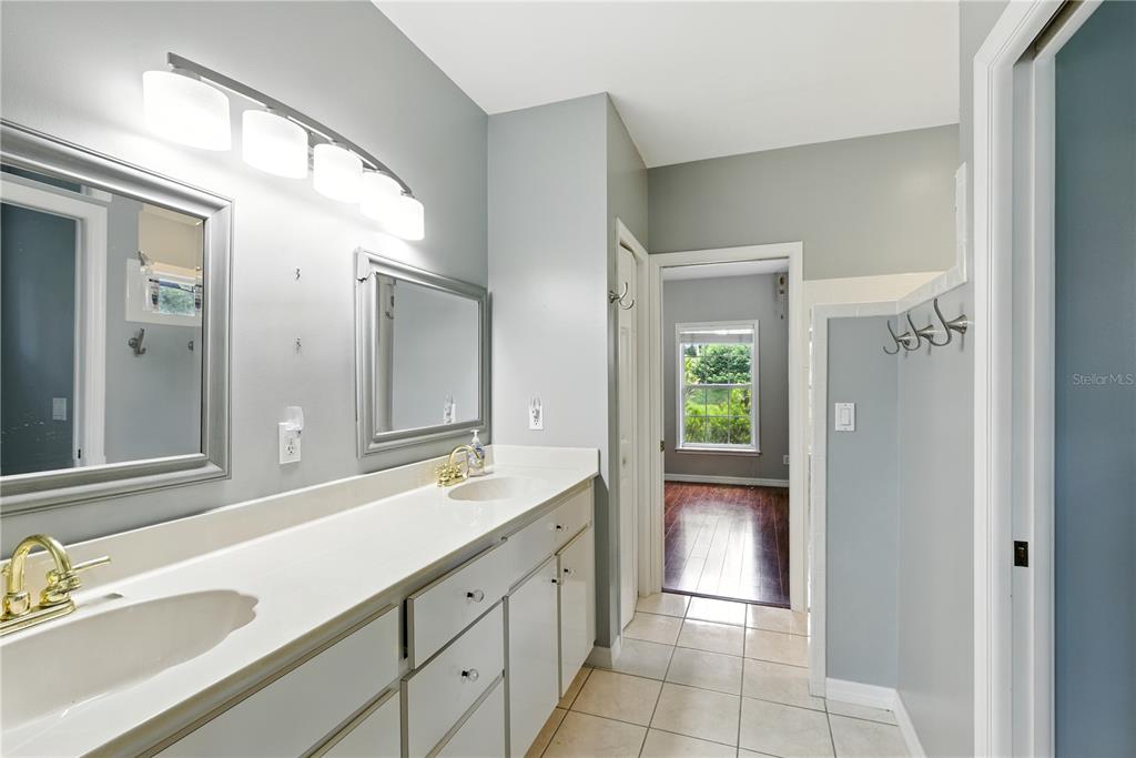 36641 Blanton Road Dade City, FL 33523 - Photo 15 of 76 a spacious bathroom with a double vanity sink and a mirror