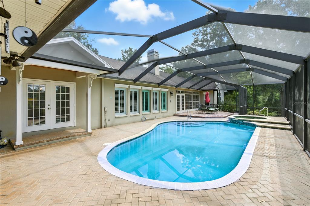36641 Blanton Road Dade City, FL 33523 - Photo 35 of 76 a view of a swimming pool with a patio