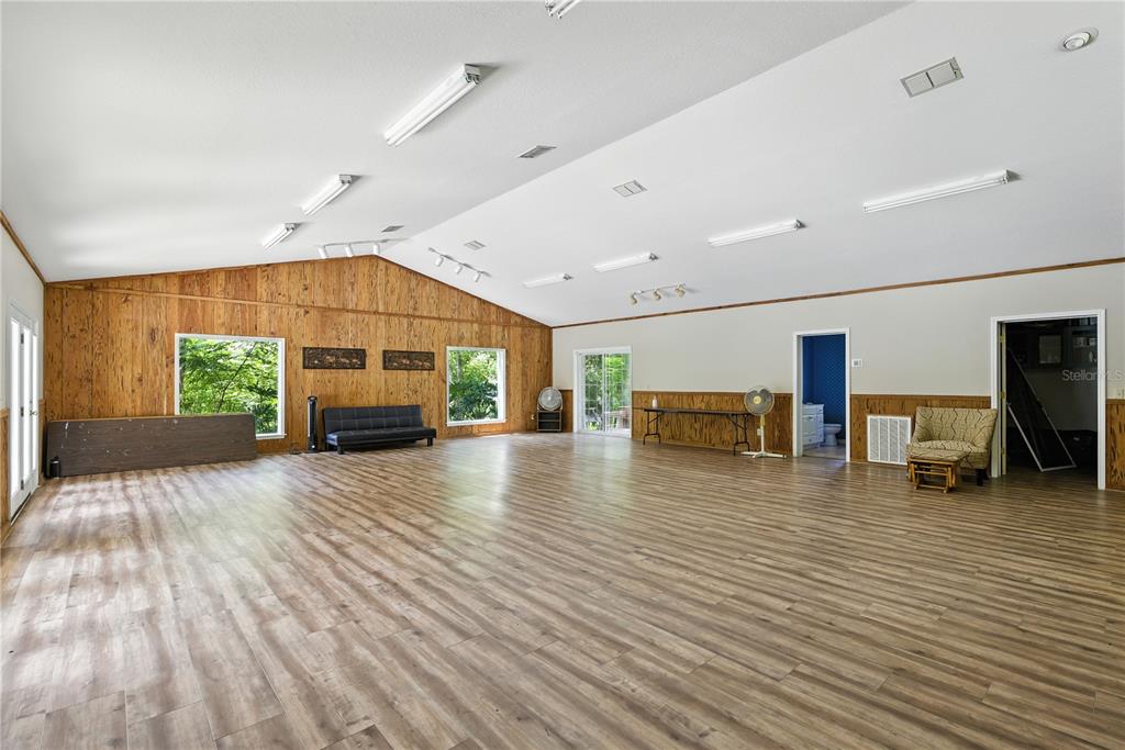 36641 Blanton Road Dade City, FL 33523 - Photo 41 of 76 a living room with furniture and a flat screen tv