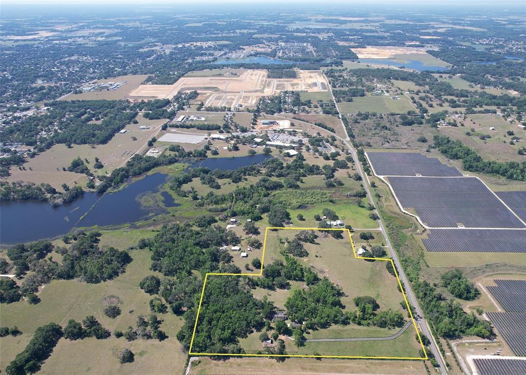 36641 Blanton Road Dade City, FL 33523 - Photo 55 of 76 an aerial view of residential houses with outdoor space