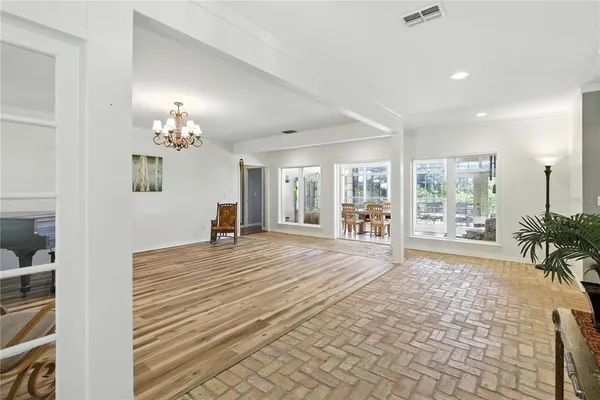 a view of a room that has a bed and a window