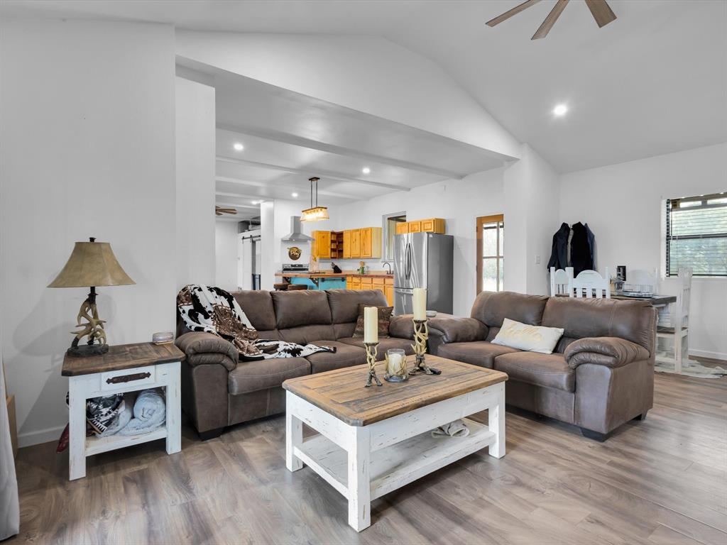 830 Louis Scherer Road Weatherford, TX 76088 - Photo 19 of 36 a living room with furniture and wooden floor