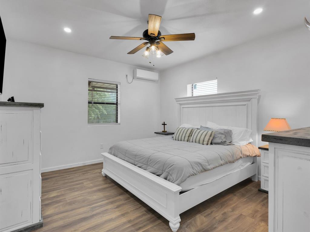 830 Louis Scherer Road Weatherford, TX 76088 - Photo 20 of 36 a bedroom with a bed and window