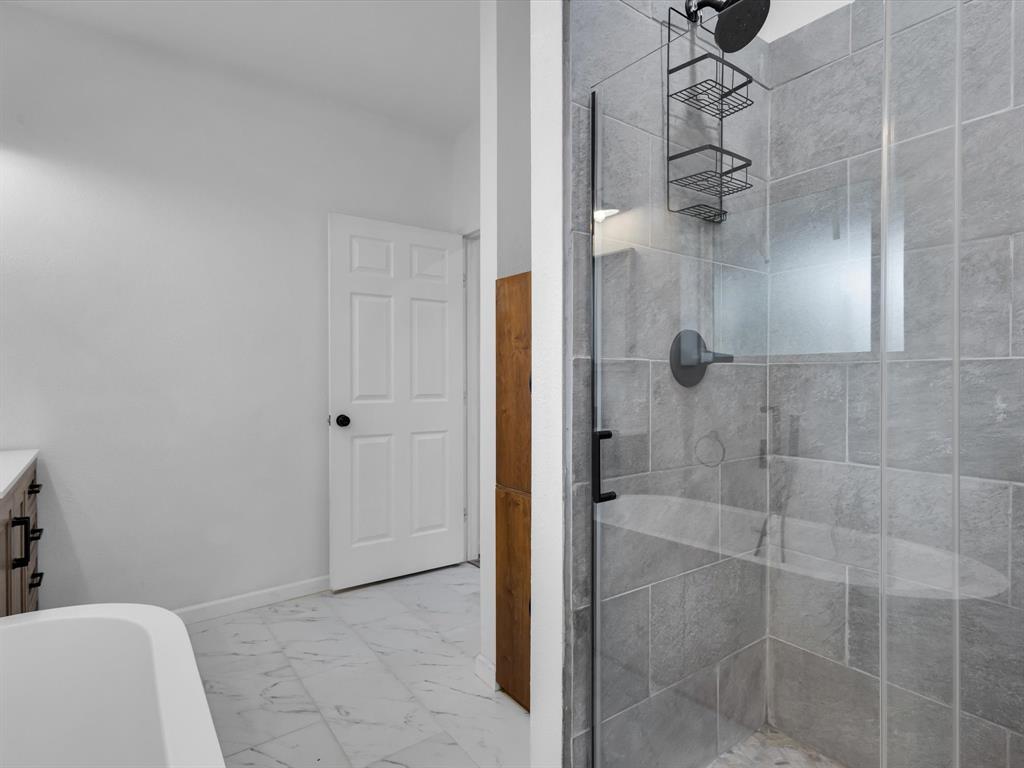 830 Louis Scherer Road Weatherford, TX 76088 - Photo 24 of 36 a bathroom with a shower