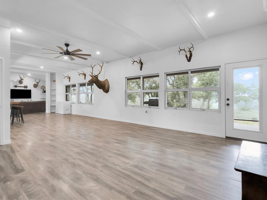 830 Louis Scherer Road Weatherford, TX 76088 - Photo 26 of 36 wooden floor in an empty room with a window