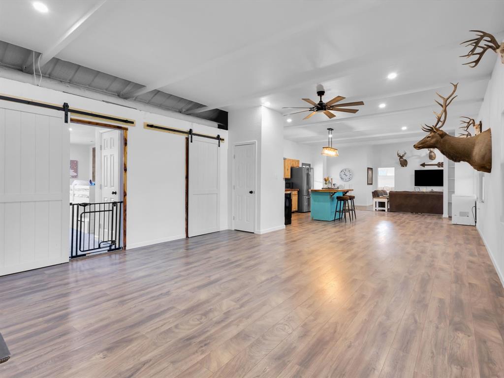 830 Louis Scherer Road Weatherford, TX 76088 - Photo 27 of 36 a view of a livingroom with furniture and a ceiling fan