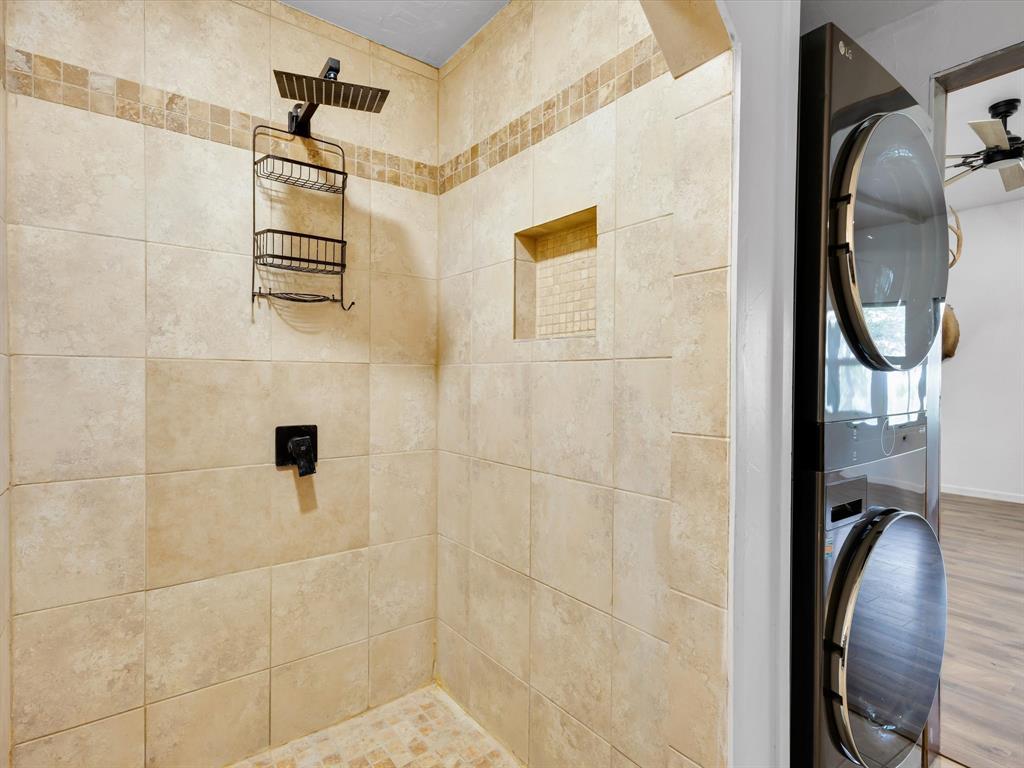 830 Louis Scherer Road Weatherford, TX 76088 - Photo 28 of 36 a bathroom with a granite countertop shower and a mirror