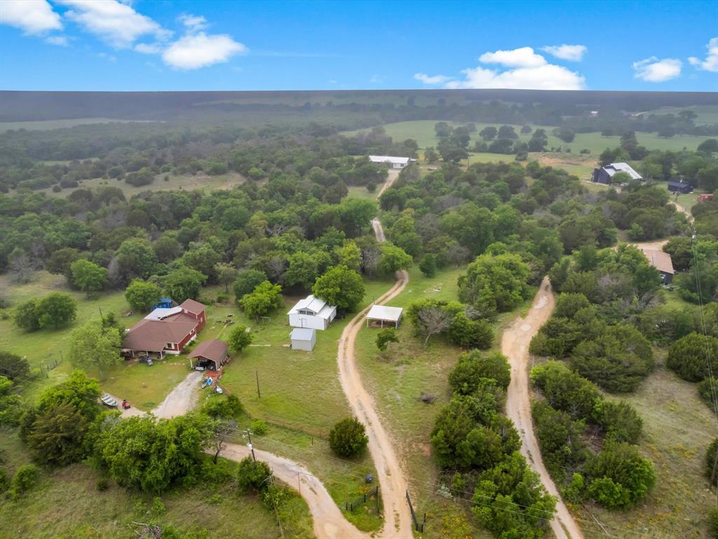 830 Louis Scherer Road Weatherford, TX 76088 - Photo 30 of 36 an aerial view of residential houses with outdoor space and trees