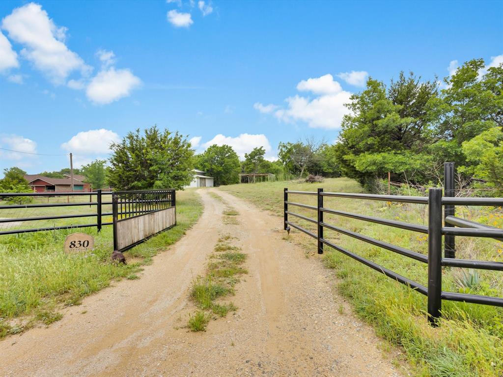 830 Louis Scherer Road Weatherford, TX 76088 - Photo 4 of 36 a park view with bench and trees