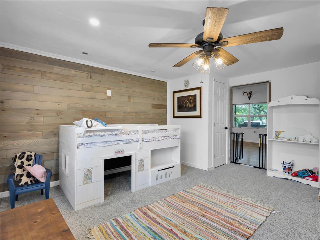 830 Louis Scherer Road Weatherford, TX 76088 - Photo 6 of 36 a living room with furniture and a fireplace
