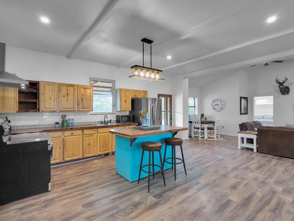 830 Louis Scherer Road Weatherford, TX 76088 - Photo 10 of 36 a view of a kitchen and dining room