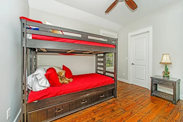 a bedroom with a bed and a dresser