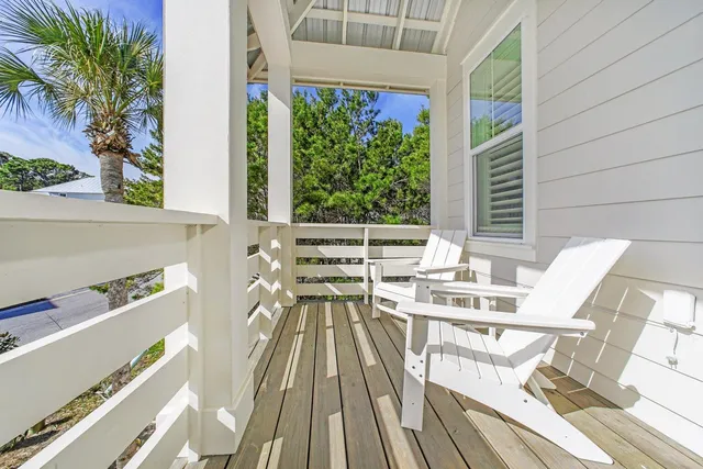 a view of balcony with a table and chairs