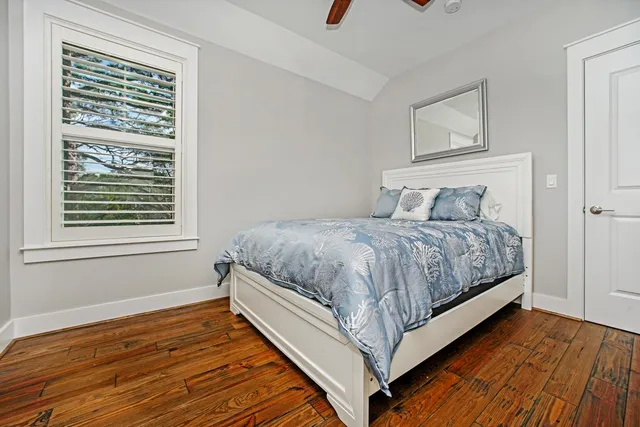 a bedroom with a bed and window