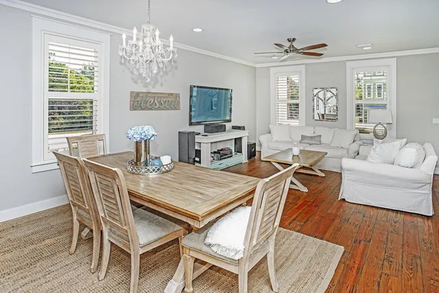 a view of a dining room with furniture window and wooden floor