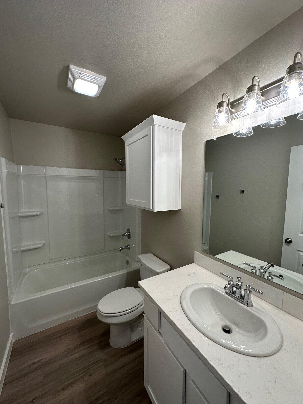 2005 135th Street Lubbock, TX 79423 - Photo 12 of 13 a bathroom with a sink toilet and shower
