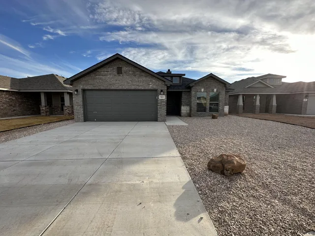 a front view of a house with yard