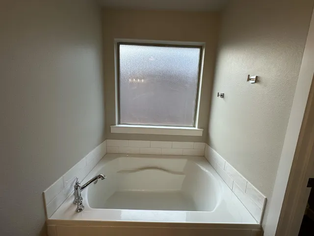 a bathroom with a bathtub