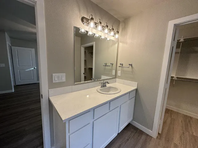 a bathroom with a sink and a mirror