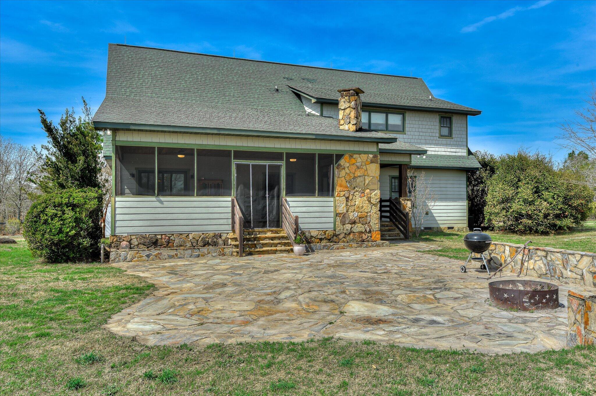 1063 Colbert Bridge Road Aiken, SC 29803 - Photo 26 of 68 a view of a house with backyard and sitting area