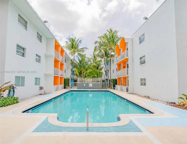 a view of swimming pool with an outdoor seating